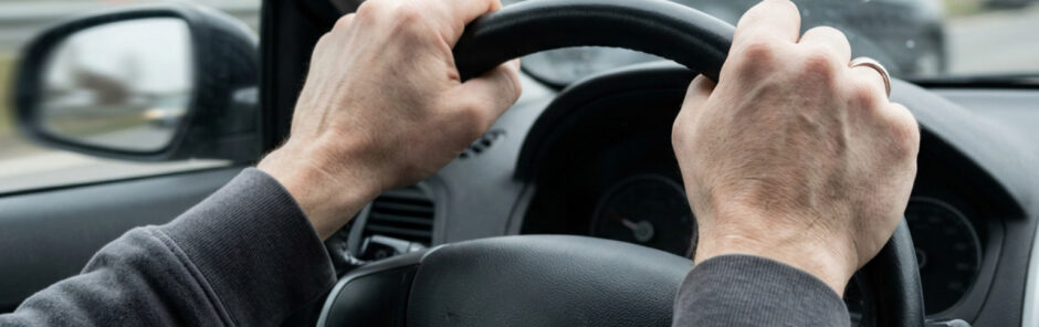 Steering wheel hand impact causing acute wrist strain during auto collision