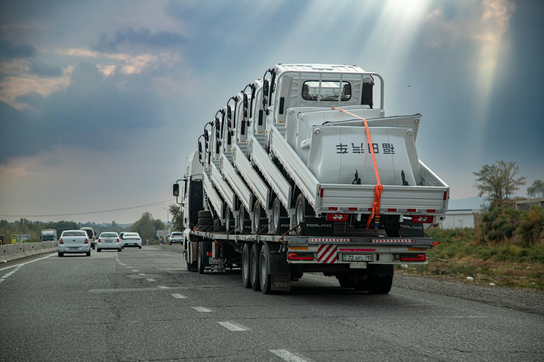 flatbed truck carrying cargo on a highway